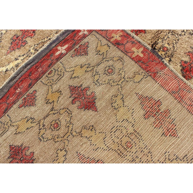 Turkish Tulu With Repeating Tribal Motifs on a Sand Field Surrounded by a Red Border For Sale - Image 12 of 13