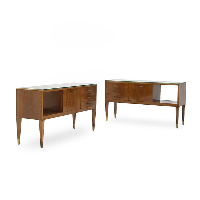 Two small walnut sideboards with brass feet and glass top, attributed to Gio Ponti