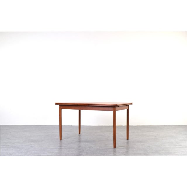 This teak table was manufactured in Denmark in the 1960s. It has been professionally and carefully restored by removing...