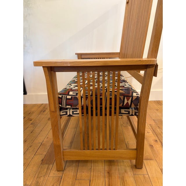 For sale in Sunapee Harbor is a Stickley mission oak bench with an upholstered seat. This bench was purchased from an...