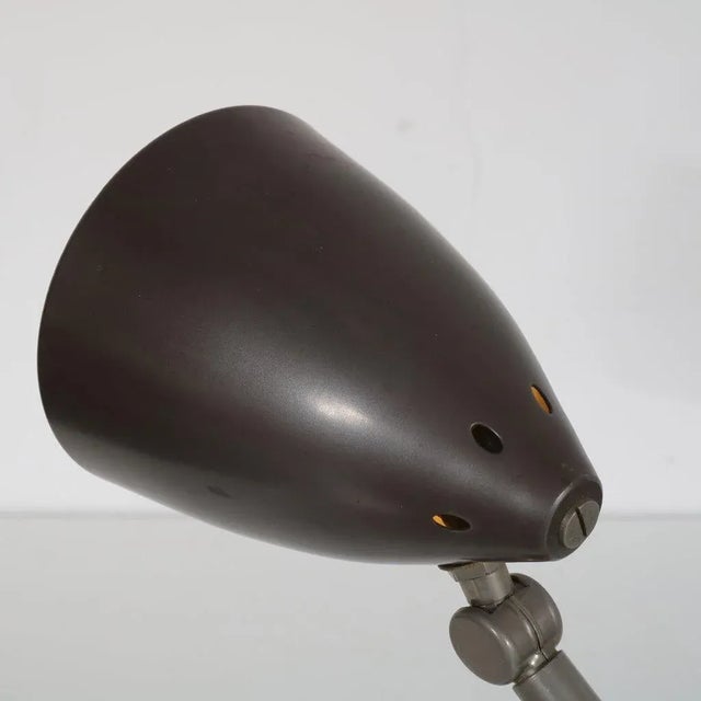 This is a nice piece of Dutch lighting design. The Hala desk lamp is made of high quality black-lacquered and grey metal....