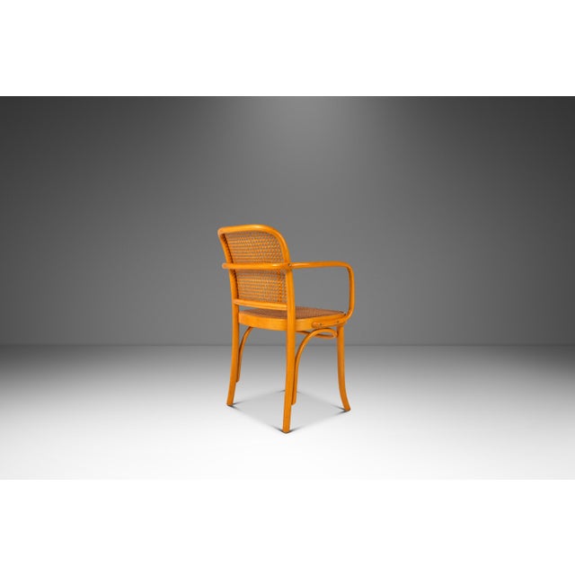 Introducing a rare blonde bentwood Model 811 armchair by the renowned designers Josef Frank and Josef Hoffmann for...