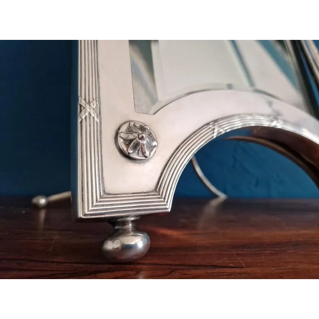 Very large and rare table mirror in the silver frame and with silver stand, from brothers Kühn in Schwäbisch Gmünd. The...