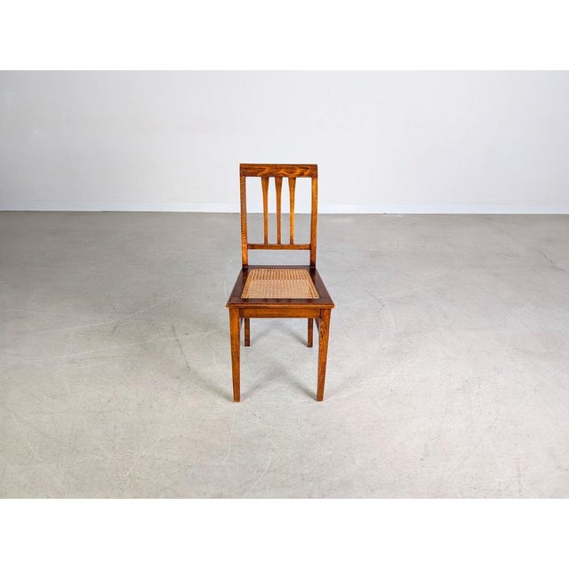 Beautiful Art Nouveau wooden chair. The chair has developed a lovely patina over the years, although the caning on the...