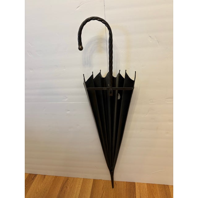 Add a touch of vintage flair to your wall with this mid-century hand-forged flat-backed wrought iron umbrella wall plaque...