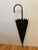 Add a touch of vintage flair to your wall with this mid-century hand-forged flat-backed wrought iron umbrella wall plaque...
