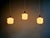 A trio of art deco pendant lights in opaline and marbled uranium glass, produced by the scailmont glassworks (in manage,...