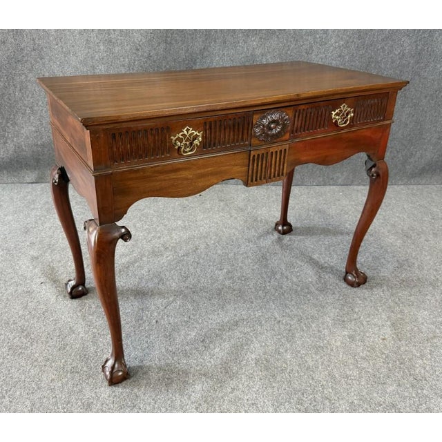 This 18th-century mahogany Chippendale server features elegant cabriole legs with pad feet, a shaped apron, and finely...