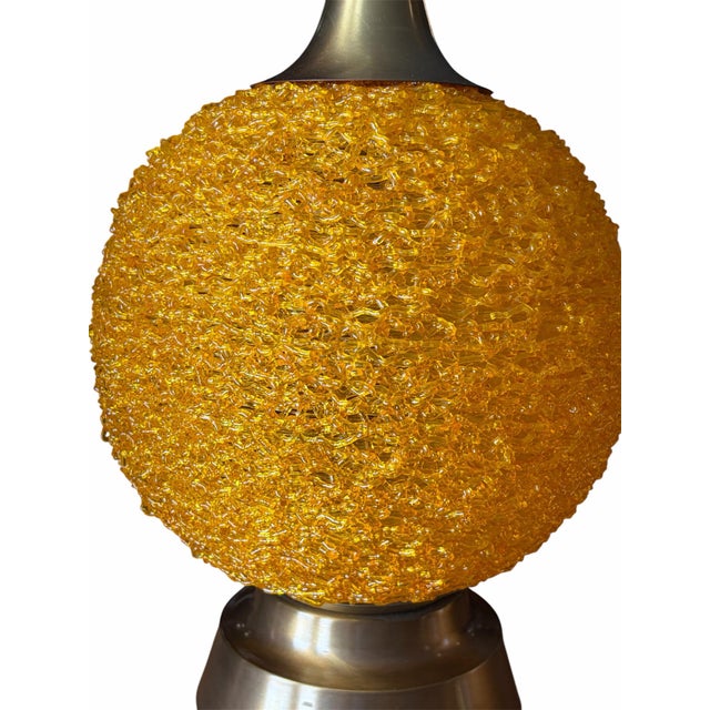 Bring a vibrant pop of retro charm into your space with this stunning Mid-Century Modern table lamp. Featuring a...