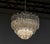 Beautiful chrome tiered chandelier attributed to Venini. The chandelier is filled with 91 clear Triedri Murano crystals...