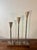 A striking set of hand fabricated American studio Brutalist candlesticks, individually signed and dated 2002. Constructed...