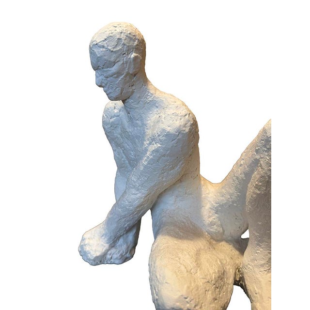 Clay sculpture of a leaning male figure created in clay and painted in gesso. This abstract figural with an impasto...