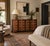 This eight-drawer vintage dresser has a rich mahogany tone and a classic Georgian block-front shape, with a serpentine...