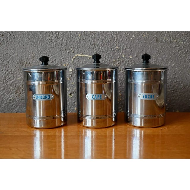 This charming series of 3 pots is a vintage Italian production. They are made of metal and bakelite. We imagine them in a...