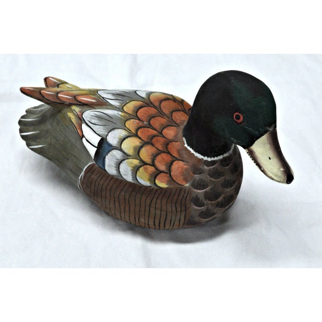 Hand-painted wooden decoy made in Indonesia. Small blow near the head, as shown in photo.