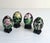 A beautiful vintage set of four Chinese cloisonné enamel porcelain eggs, each decorated with intricate gold‑outlined...