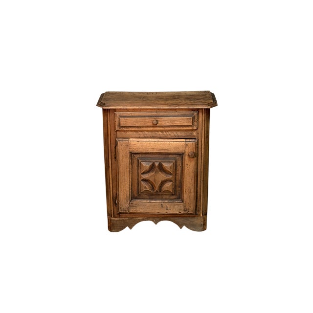 Antique cabinet made from an 18th-century walnut kneeler, featuring a diamond-shaped door and upper drawer. The harmonious...