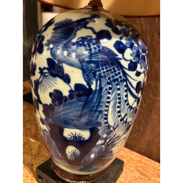 A magnificent, fully realized 23-inch Chinese blue and white porcelain table lamp, styled to absolute perfection and fully...