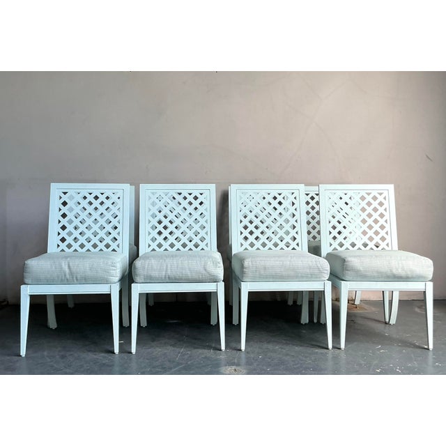 Elevate your dining experience with this stunning set of eight vintage chairs from the esteemed American maker, McKinnon...