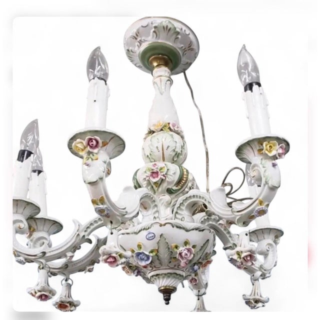 What we have here is a French Vintage Limoges Porcelain 6 Arm Chandelier Circa 1950’s. It has Exquisite-porcelain flowers...