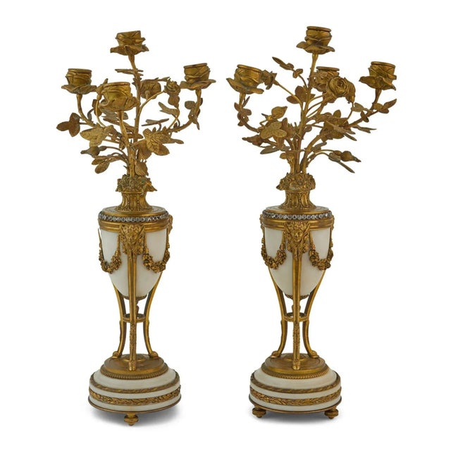 Tiffany French Louis XVI Clock Garniture Set, Bronze, Marble, 19th/20th Century A French Louis XVI style three-piece gilt...
