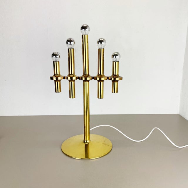 Table light. Origin: Italy Age: 1970s. Original 1970s table light made in Italy. This wonderful modernist 1970s table...