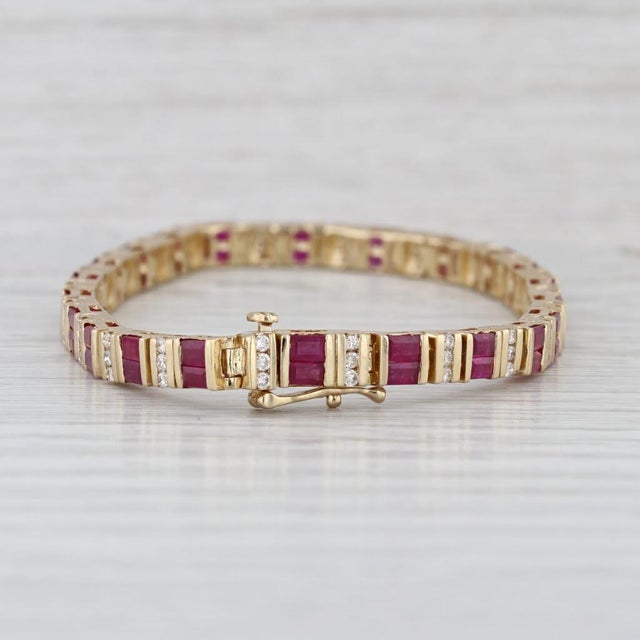 Gemstone Information: - Natural Rubies - Total Carats - 5.50ctw Cut - Baguette Color - Red Treatment - Routinely Enhanced...
