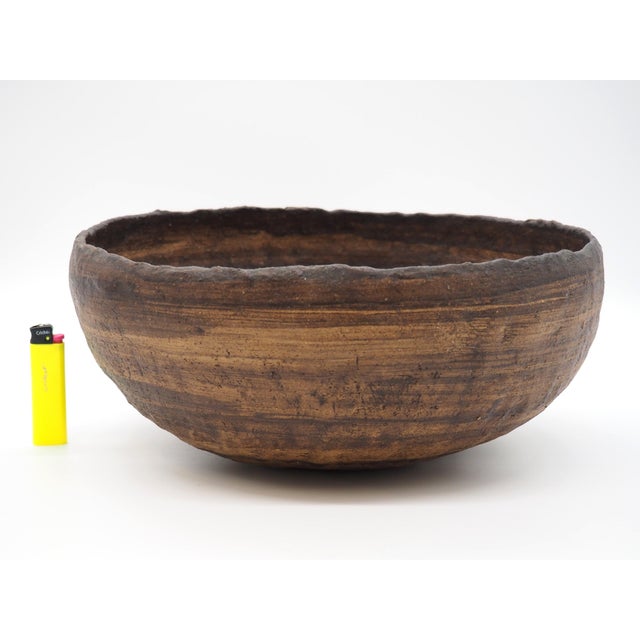 A heavy and rustic ceramic bowl in shades of brown with a real old vintage feel from the 70´s. A beautiful feature on the...