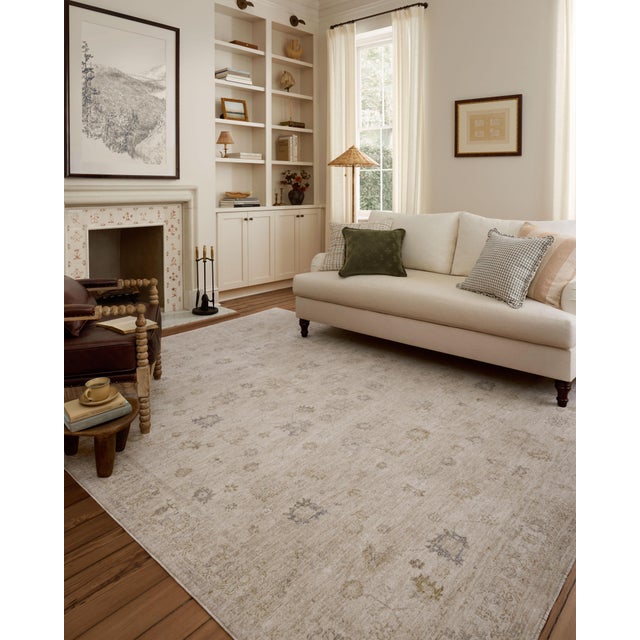 The Louisa Collection is a serene area rug based on beautiful, traditional Turkish designs updated in calm colorways by...