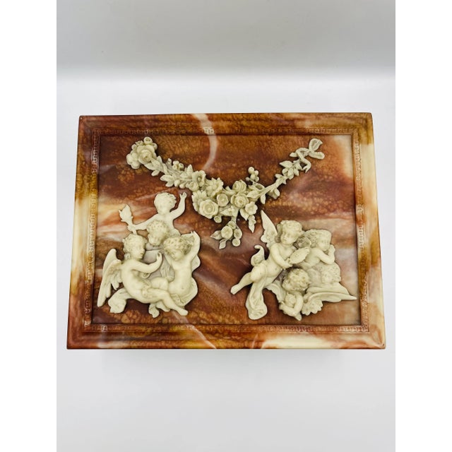 This Stunning and Substantial old treasure box by Incolay Stone offers the height of classical beauty with the carved...