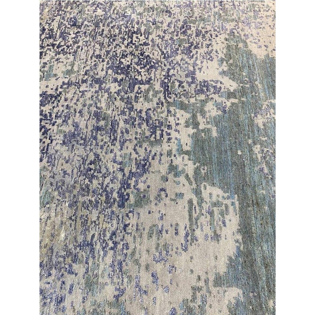 Transform your space with a 12x15 modern abstract rug from India, showcasing intricate designs and vibrant colors for a...