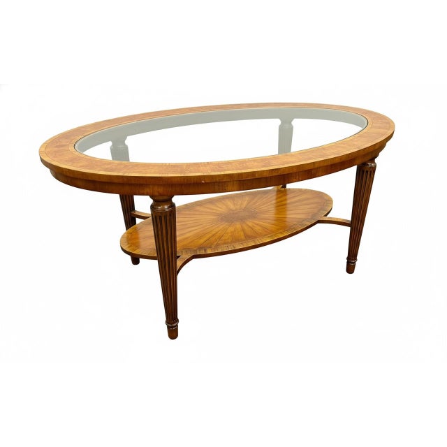 The Maitland Smith Marquetry Oval Two-tier Cocktail Table is a luxurious and stylish addition to any living room. Made of...