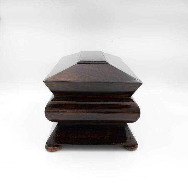 William IV period, circa 1830–1837 A rosewood box with an accordion-profiled case resting on small turned bun feet. The...