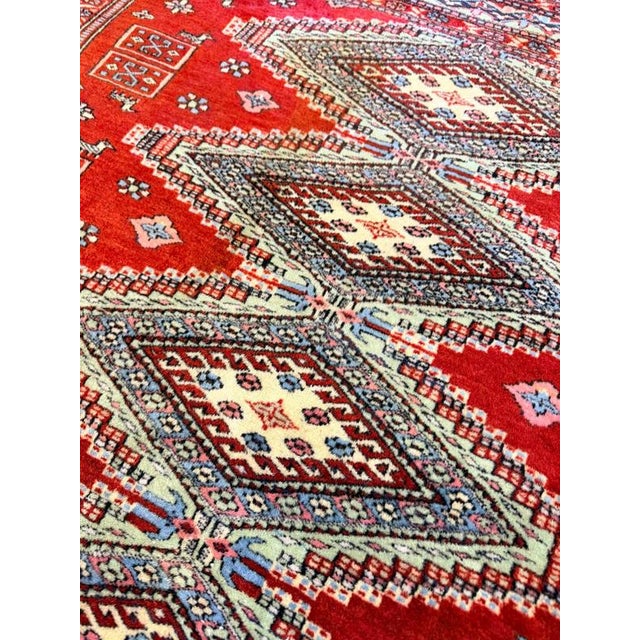 This vintage Afghani hand-knotted rug is crafted with a fine weave, featuring a super soft texture and a sleek, thin pile....