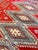This vintage Afghani hand-knotted rug is crafted with a fine weave, featuring a super soft texture and a sleek, thin pile....