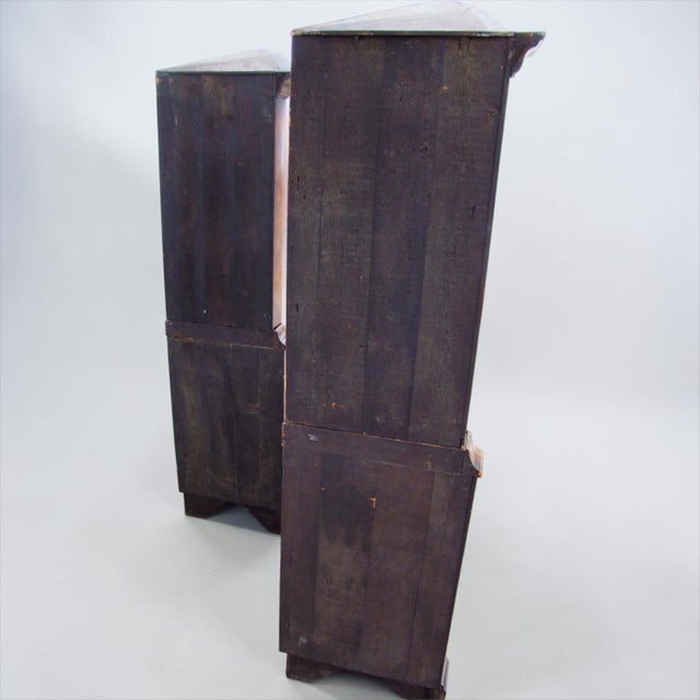This is a pair of English burl walnut corner cabinets with Dutch colonial styling. The secondary wood is pine. The...