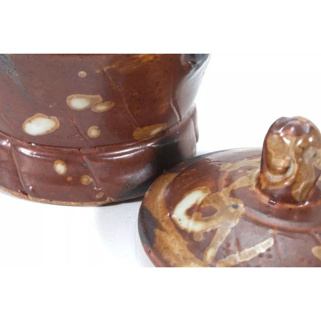 A modernist stoneware glazed ceramic sugar and creamer holders by Detroit artist John Glick of Plum Tree Pottery. Circa...