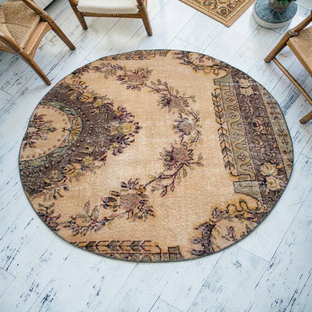 This striking upcycled round rug breathes new life into a vintage hand-knotted Kayseri carpet, reimagining traditional...