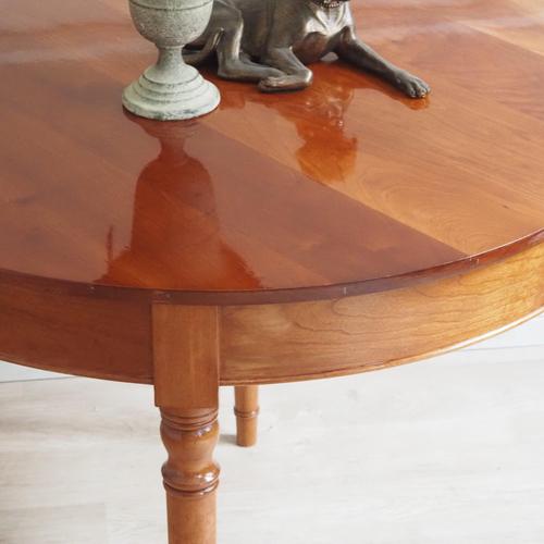 This stylish round dining table was crafted from cherry wood in the mid-19th century during the Biedermeier period. Its...