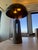 This is a designer table lamp by Apparatus within the metronome line. It is in the oiled rubbed bronze and suede. This is...