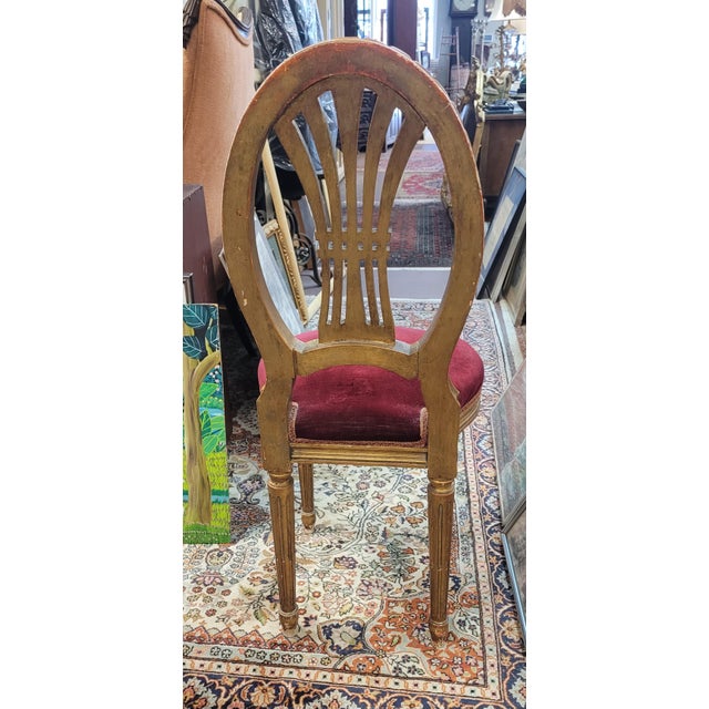 Fine antique French carved giltwood vanity chair with a red velvet seat. Features fluted legs kidney shape balloon seat...