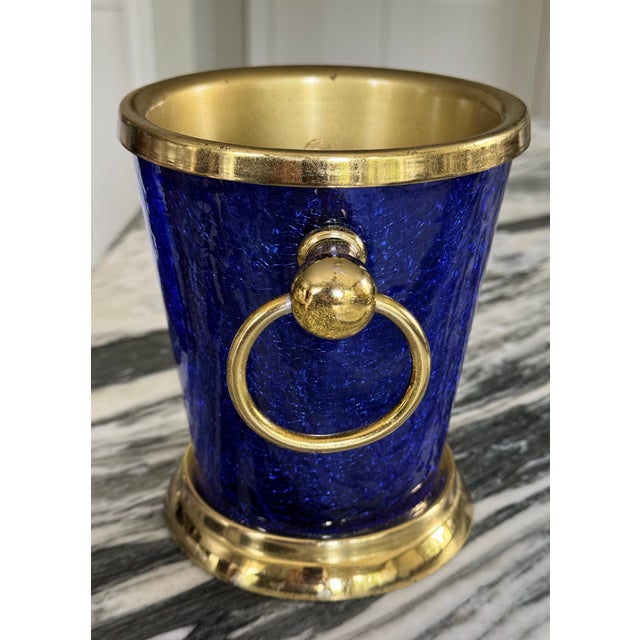 Here is a classic wine chiller in jewel tone cobalt blue craquelure finish and brass accents by Nicole Miller. It is heavy...