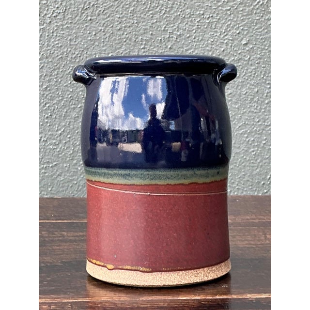 This vintage handcrafted ceramic vase showcases the refined simplicity and bold color palette characteristic of mid-...