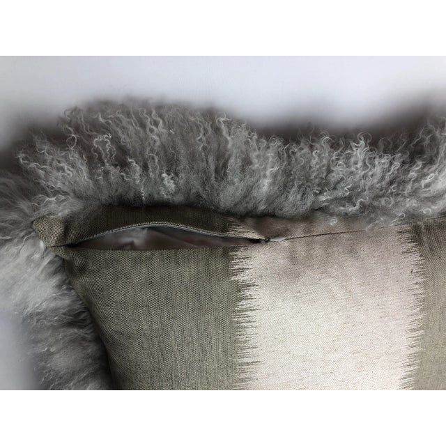 This beautiful premium cashmere goat skin is backed in an equally beautiful Kravet fabric. It is a soft smokey gray to...