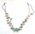 This fetish necklace originates from the Pueblo Native American tribes, likely Santo Domingo (Kewa Pueblo) or Zuni, and...