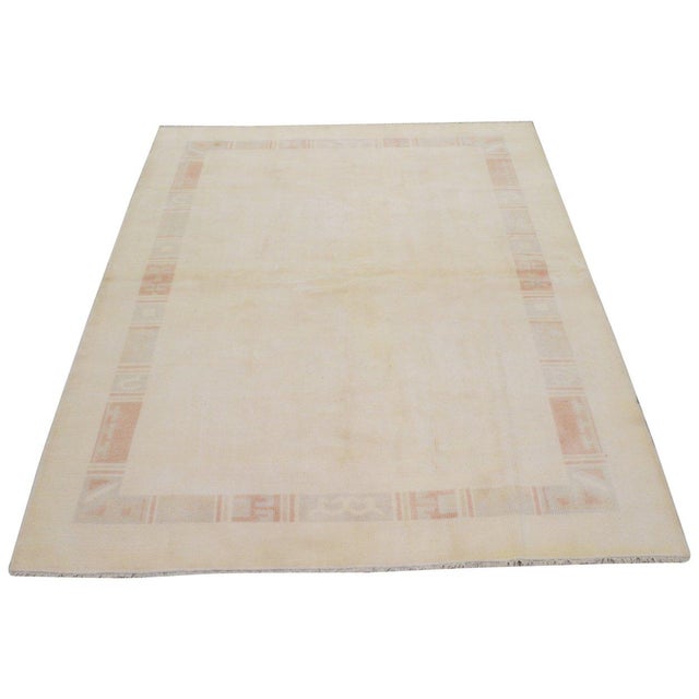 Hand-knotted with care using traditional rug-making techniques, this wool rug blends timeless craftsmanship with a modern...