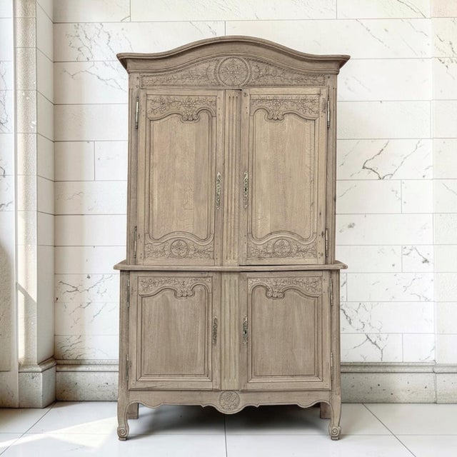 A 19th century Country French Normandy Louis Philippe period buffet à deux corps crowned with an arched top known as a...