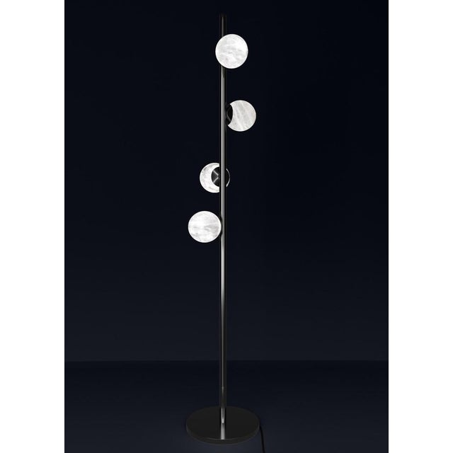 Ofione shiny black metal floor lamp by alabastro italiano dimensions: d 50 x w 50 x h 170 cm. Materials: white alabaster...