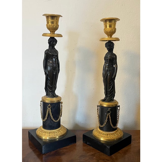 Pair antique early 19th century French Empire gilt & patinated bronze caryatid candlestick holders circa 1810. Each...