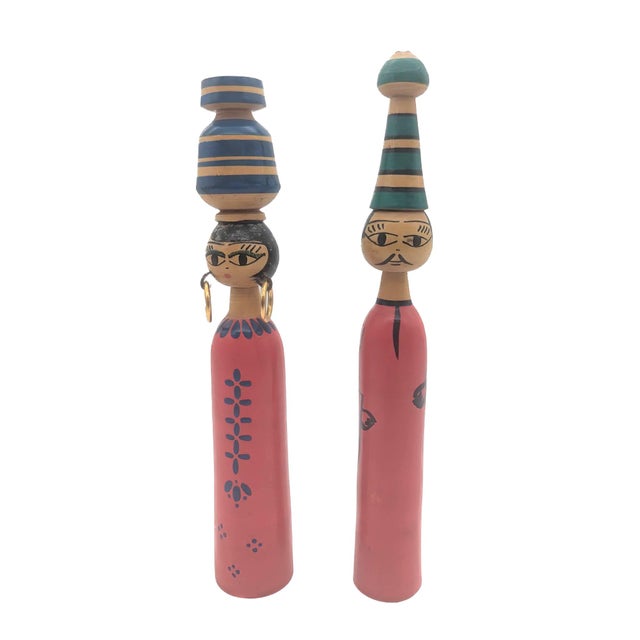 Offered is a pair of North African carved and painted wood spindle doll figurines. They are likely from Egypt, Tunisia, or...